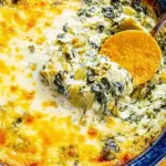 Delicious hot spinach artichoke dip served with crispy tortilla chips